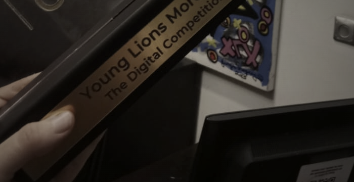 A hand holding the Young Lions Morocco Gold award